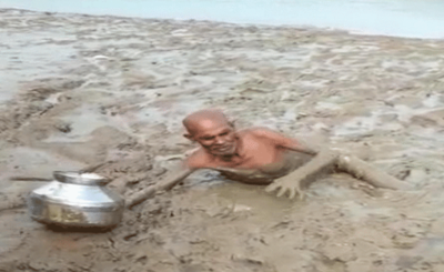 old man stuck in mud