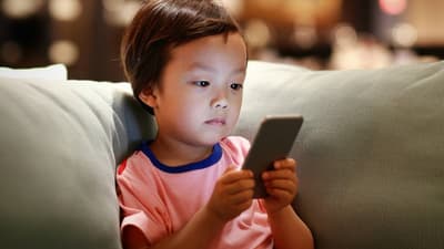 little-boy-looking-at-phone-on-couch-768x432-1515610886.jpg